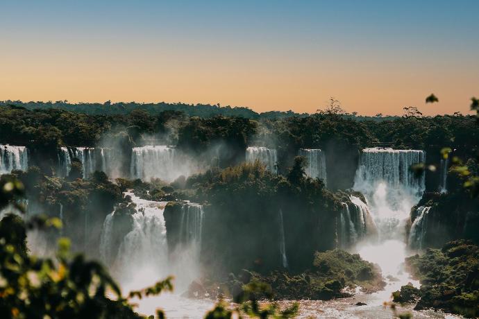 waterfalls under blue sky during daytime